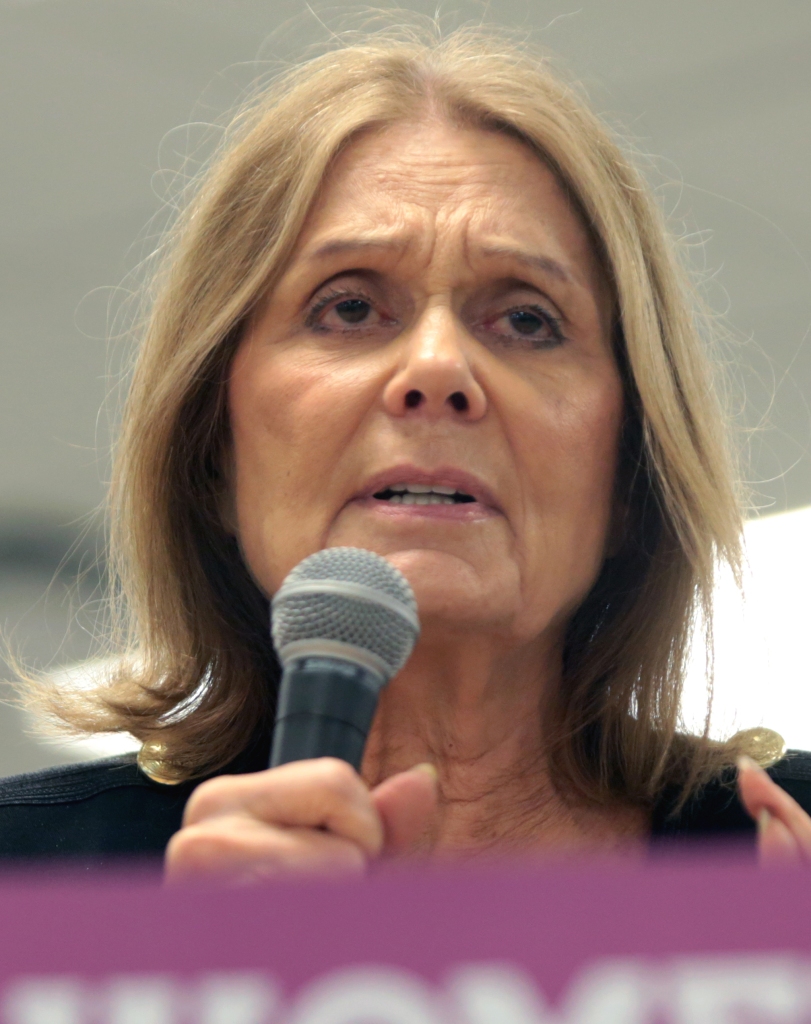 Gloria Steinem holding a microphone